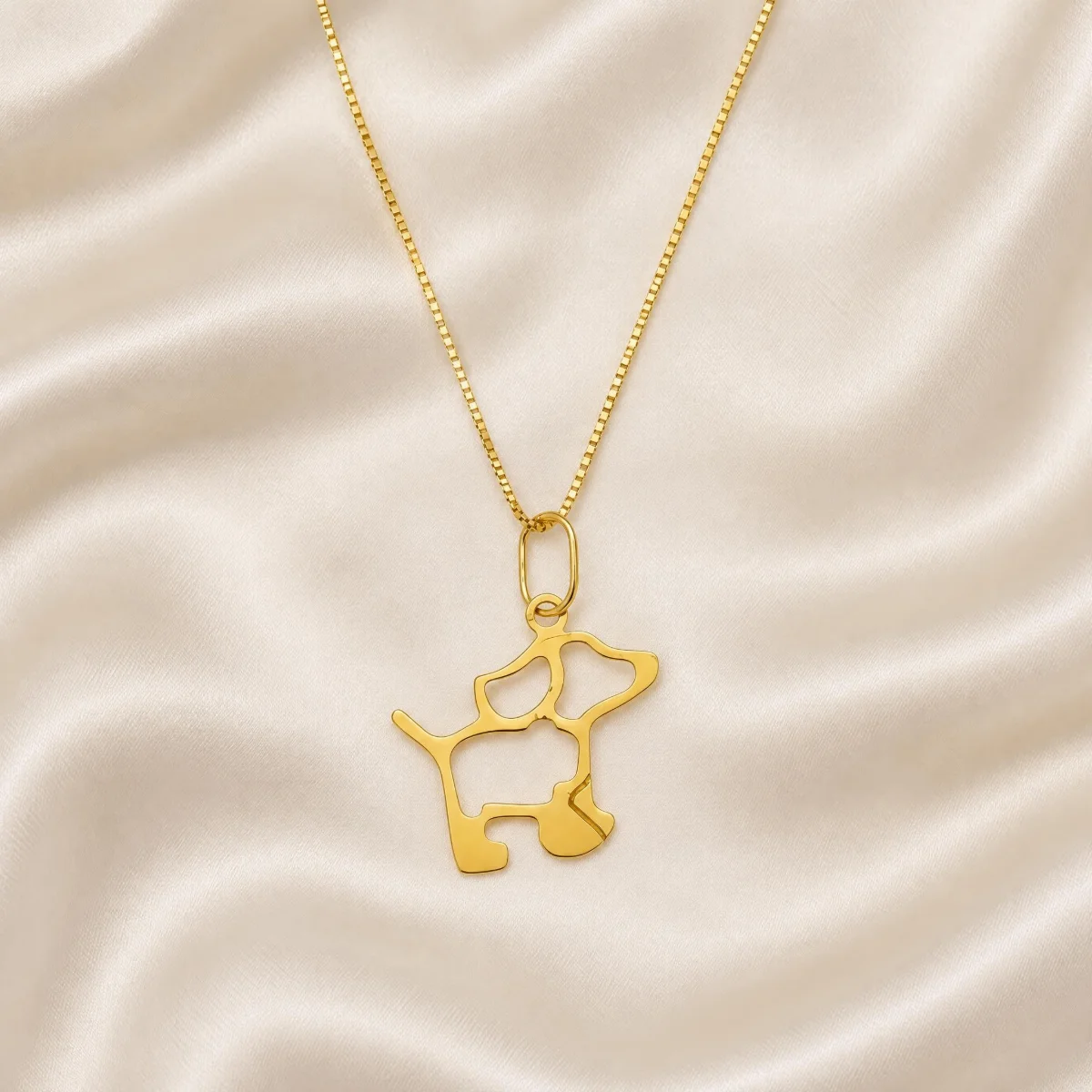Pingente Cachorro em Ouro 18k, em foto de estúdio